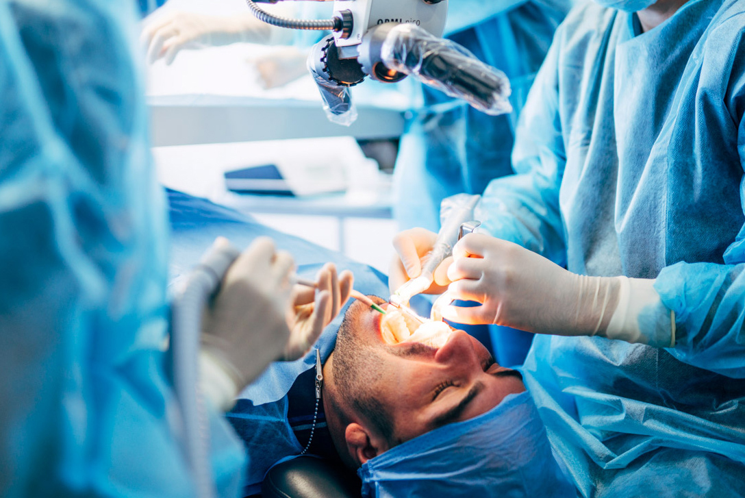 Team dental surgeons working in dental clinic.